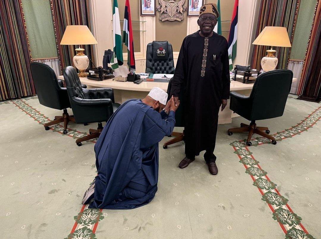 Photo of the Day: Reactions as Gov Bago visits, kneels before Tinubu