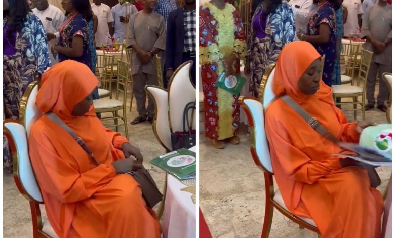 Drama As Aisha Yesufu Refuses To Stand For New National Anthem, Others Laugh Instead Of Singing(VIDEO)