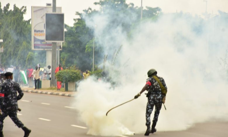  Policemen Fire Gunshots As They Clash With Protesters In Abuja